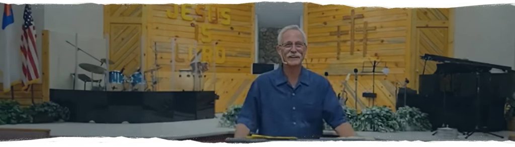 Image presents a picture of Pastor David Wright preaching, to support the web page invitation to "Join Us Sunday" for Sunday morning worship.